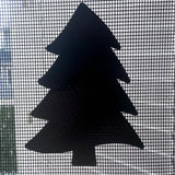 Black silhouette of a Christmas tree on a window screen