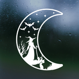 White silhouette of a witch and cat on a crescent moon with bats and stars against a dark background