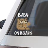 Die-cut vinyl car decal featuring two cute brown cartoon owl characters with big eyes and raised wings, arranged in two pairs. Top text reads 'KID'S ON BOARD' in blue, bottom text reads 'TWINS ON BOARD' in blue. Playful design for parents of twins.

