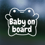 White 'Baby on board' decal on a dark, rain-dotted window