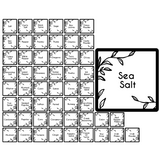 Collection of black and white seasoning labels with a prominent 'Sea Salt' label.