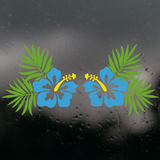 Blue flowers with green leaves on a wet glass background