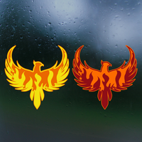 Two phoenix decals, one yellow and one red, on a textured dark surface.