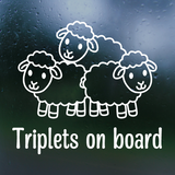 Sheep family decal with 'Triplets on board' text on a dark background